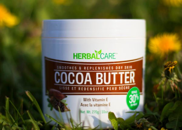 HERBAL SMOOTHES & REPLENISHES DRY SKIN COCOA BUTTER 10oz in grass